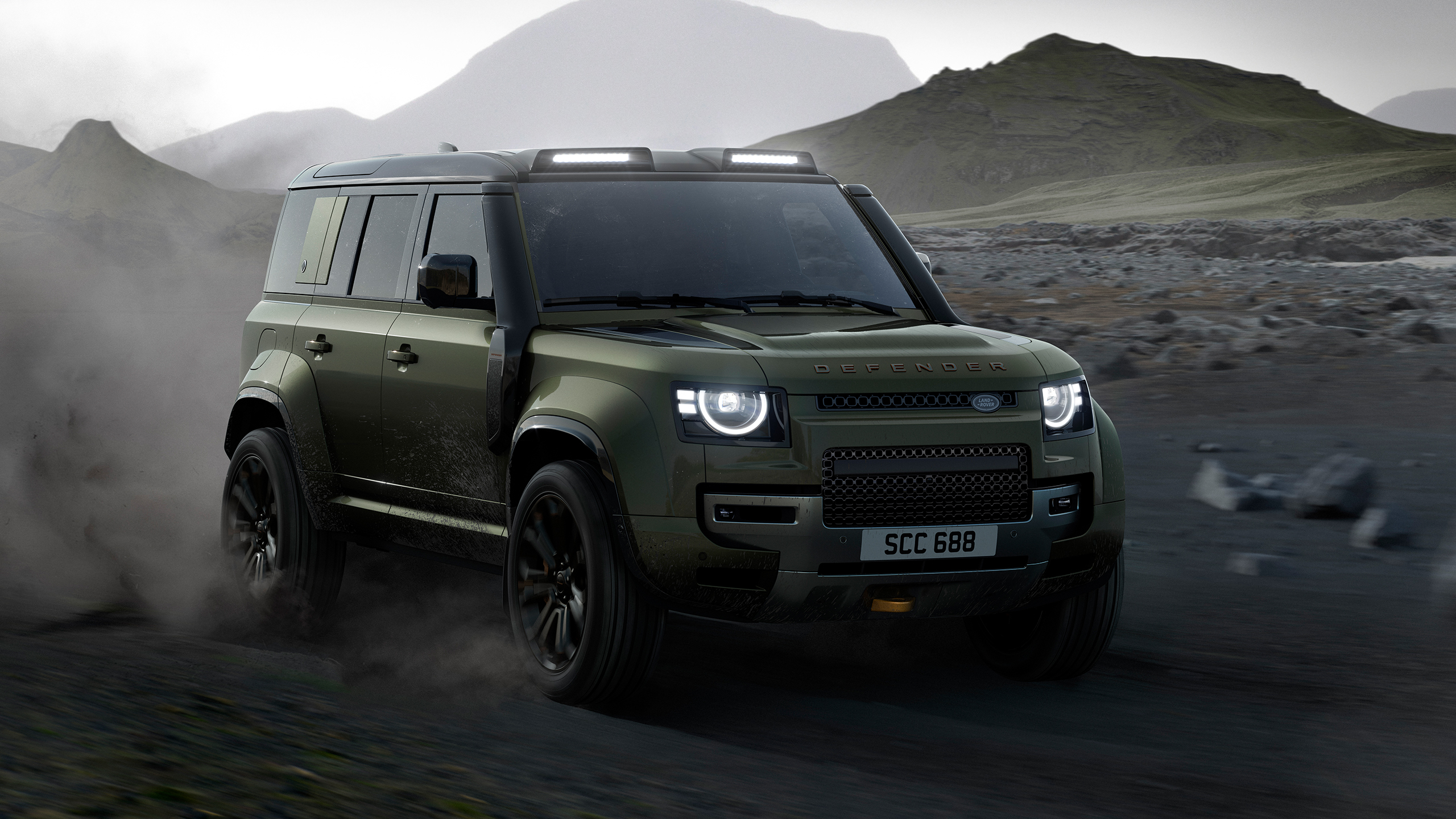 Defender runninng on sand dust road
