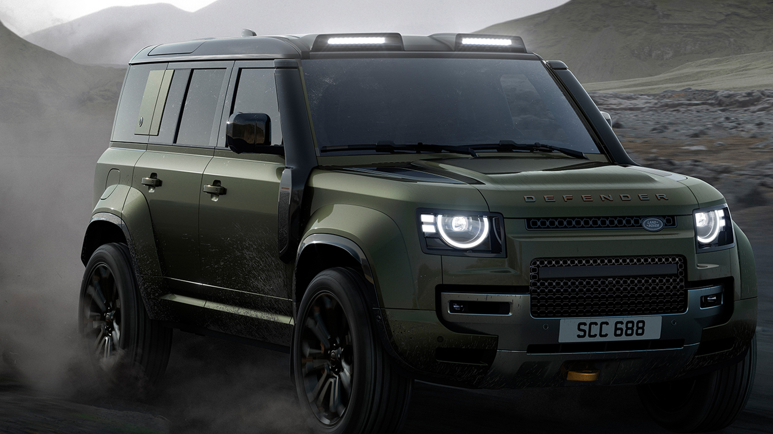 Defender runninng on sand dust road